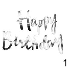 Zlaté narodeninové vlajky s nápisom Happy Birthday.
