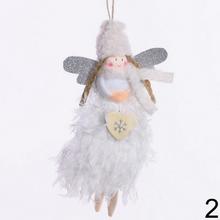 Biele anjeliky s trblietavými krídlami a ozdobami.