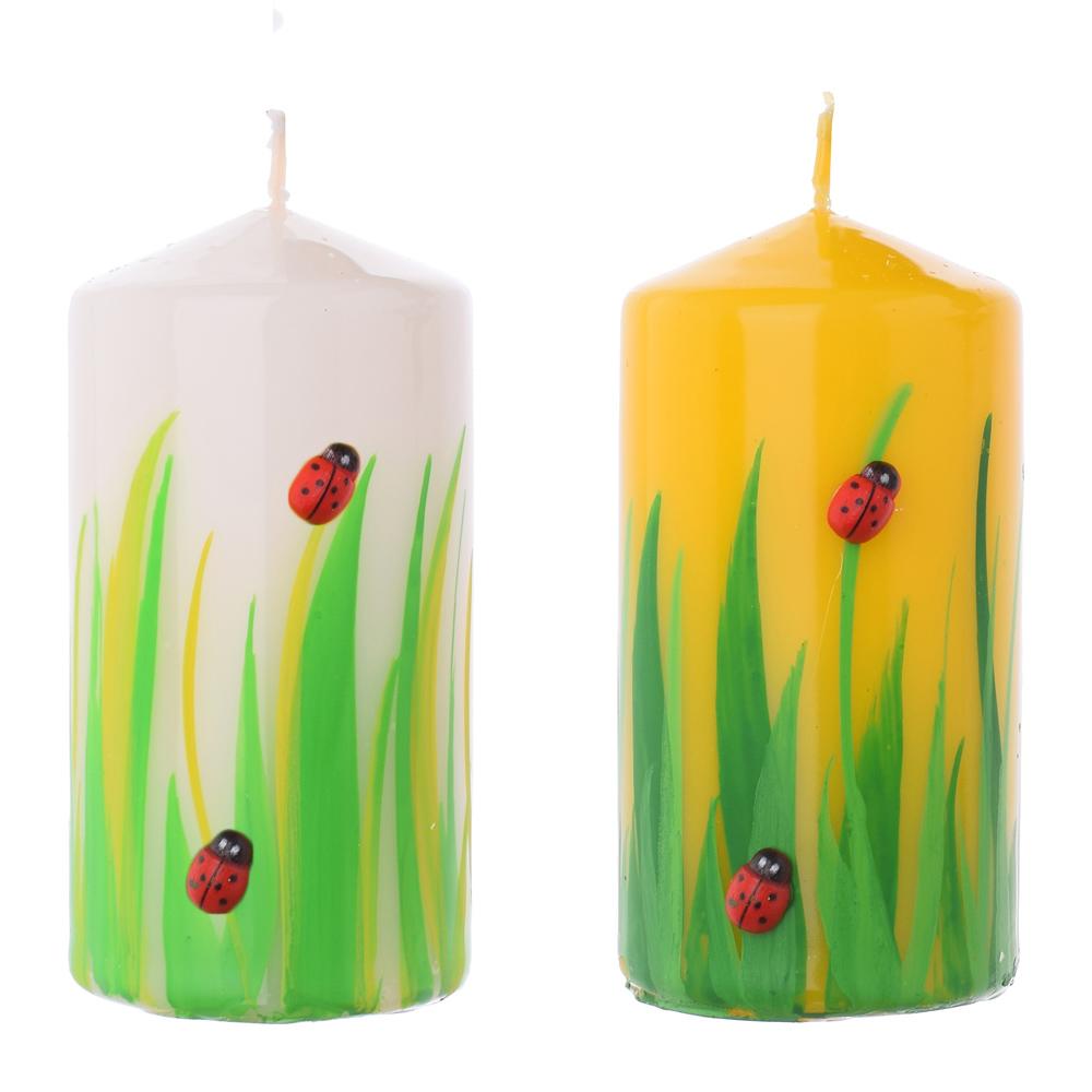 Svíčky válec s motivem berušky a trávy.
