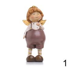 Dve deti s krídlami, keramické dekorácie na Vianoce.