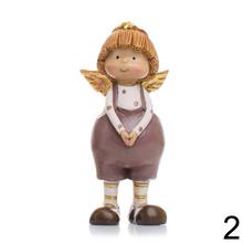 Dve deti s krídlami, keramické dekorácie na Vianoce.