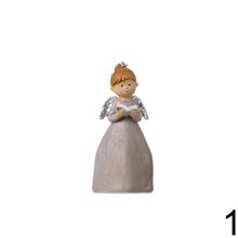 Súprava troch dekoratívnych anjelov s knihou, sviečkou a krížom.