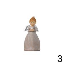 Súprava troch dekoratívnych anjelov s knihou, sviečkou a krížom.