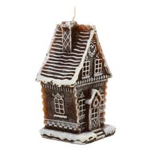 Malý hnedý perníkový domček sviečka.