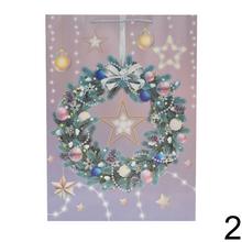 Darčeková taška s vianočným motívom a glitrami.