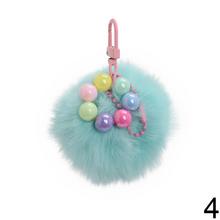Prívesok chlpáč v rôznych farbách s guľôčkami.