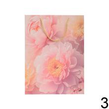 Darčeková taška s kvetinovým vzorom a trblietkami.