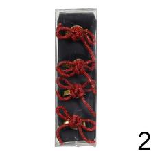 Kružky na servítky v červenej a zlatej farbe.