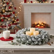 Zasnežený veniec z čečiny s priemerom 50 cm.