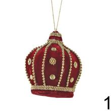 Závesná ozdoba v tvare korunky v červenej a bielej farbe.