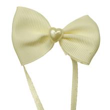 Mašličky v krémové barvě, balení 8 kusů.