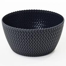 Designová mísa v antracitové barvě vyrobená z umělé hmoty.