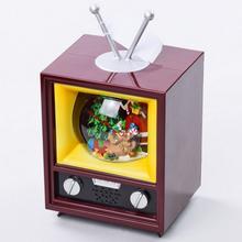 Vánoční LED lampáš ve tvaru televize s hudbou.