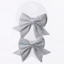 Stříbrné mašle na vánoční dekorace.