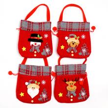 Vánoční tašky na dárky s různými motivy.