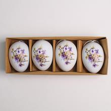 Sada plastových vajíček s květinovým vzorem v bílo-fialové barvě.