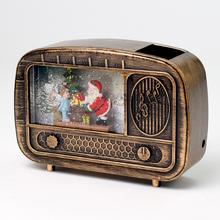 LED rádio USB a lampáš se zlatým Santou.