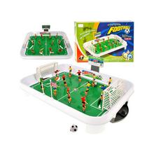 Stolní fotbal s pružinami a hráči na hřišti.