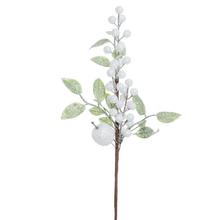 Umělá větev se zelenými listy a bílými bobulemi.