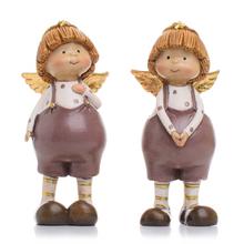 Dvě děti s křídly, keramické dekorace na Vánoce.