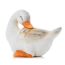 Keramická bílá-hnědá husa spící.