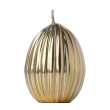 Malé vroubkované zlaté vajíčko svíčka.