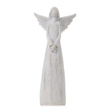 Bílý dekorativní anděl s křídly.