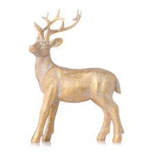 Vánoční dekorativní jelen ve zlaté barvě.