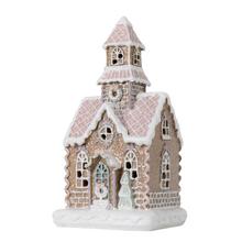 Růžový perníkový domeček s LED osvětlením.