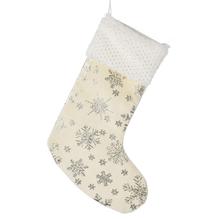 Vánoční punčocháč s vzorem sněhových vloček v krémové barvě.