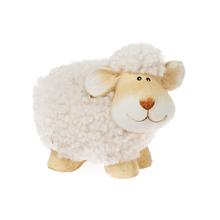 Bílá keramická ovečka s jemným povrchem.