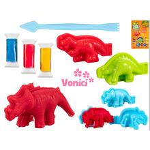 Modelovací hmota s dinosaury a barvami.