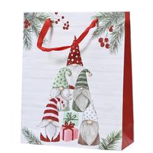 Vánoční papírová taška s glitry a motivem Mikulášů.