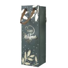 Vánoční papírová taška s textem 'MERRY CHRISTMAS'.