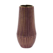 Kulatý obal burgundské barvy se zlatými pruhy.