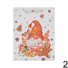 Dárková taška s vánočními motivy a glitry.