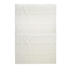 Ubrus s vánočním vzorem v krémovo-zlaté barvě.