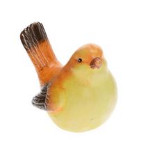 Keramický ptáček v žluto-oranžové barvě.