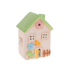 Zelený keramický domeček s LED osvětlením.