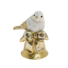Keramická ptáček na zvonku v bílé a zlaté barvě.