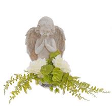 Smuteční vazba s andělem a květinami.