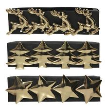 Zlaté ubrousky s motivy soba, stromečku a hvězdy.