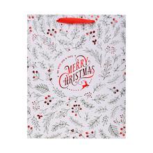 Vánoční taška s květinovým vzorem a nápisem Merry Christmas.